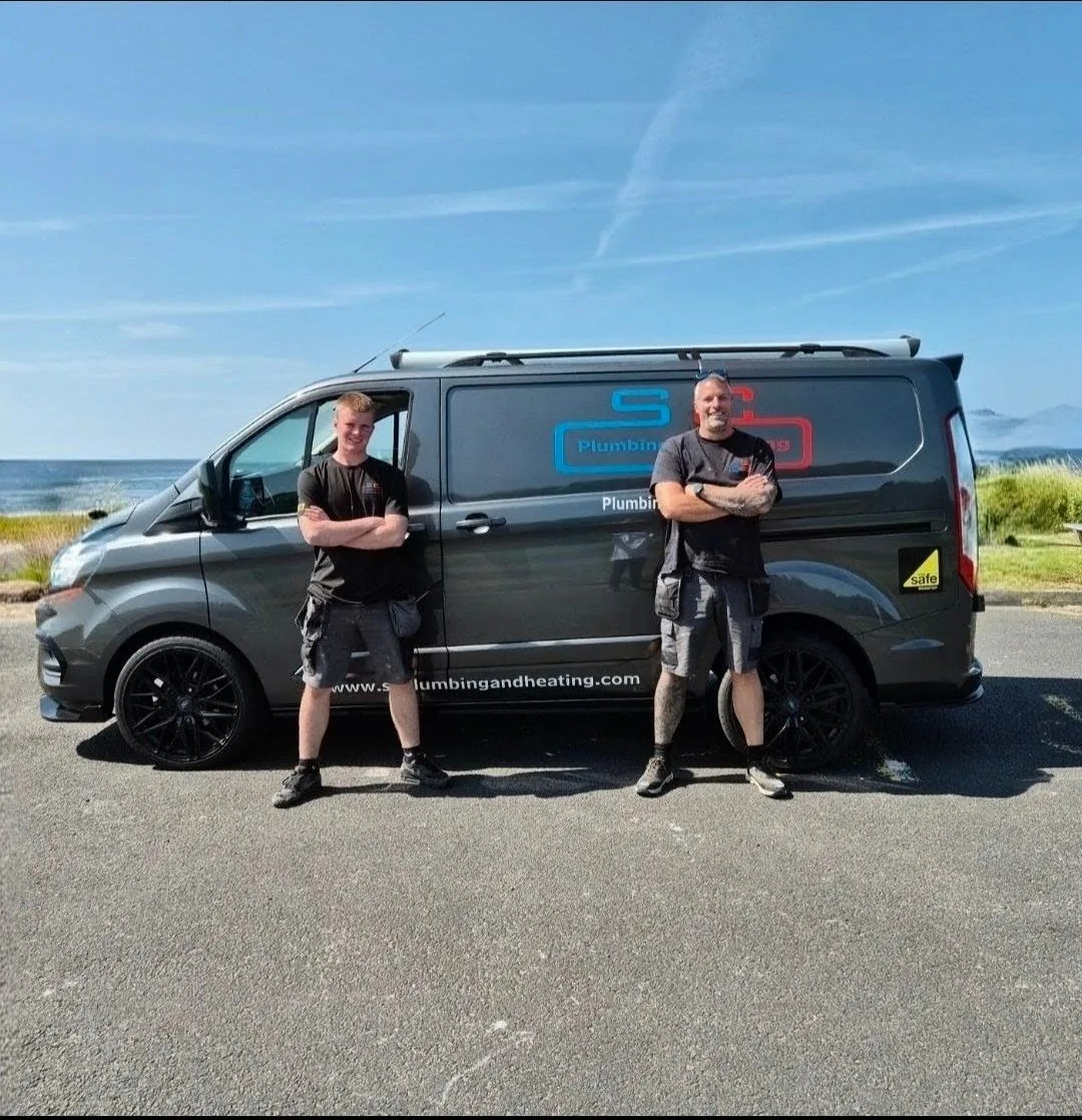 Steven Cowan and his son Blaine in SC Plumbing and Heating uniform in front of the company van in Ayrshire