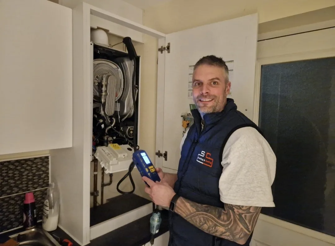 Steven Cowan of SC Plumbing and Heating commissioning a newly installed boiler
